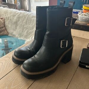 Slightly worn waterproof black heeled boots with silver hardware